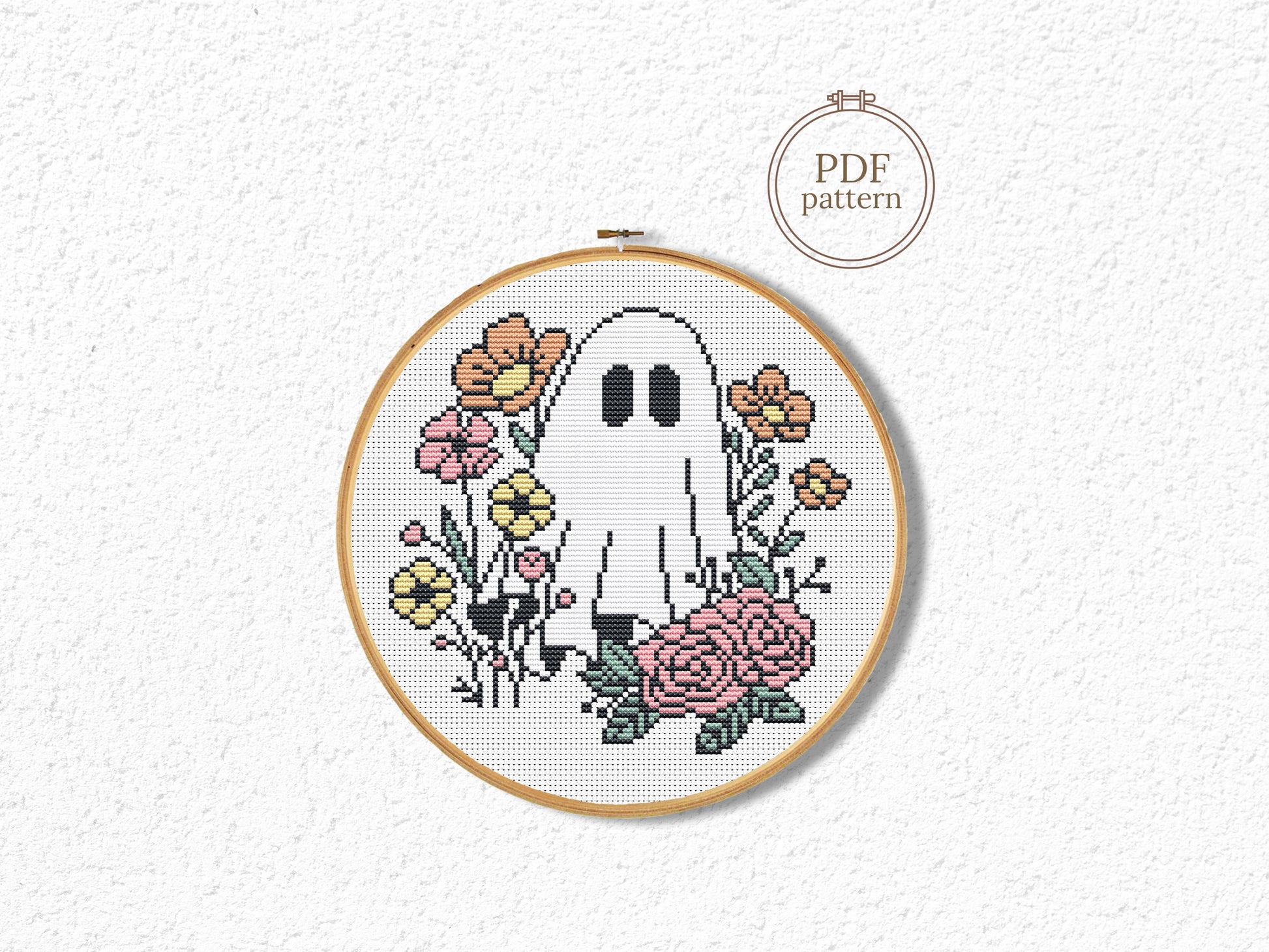 Halloween cross stitch pattern with ghost Jack and flowers
