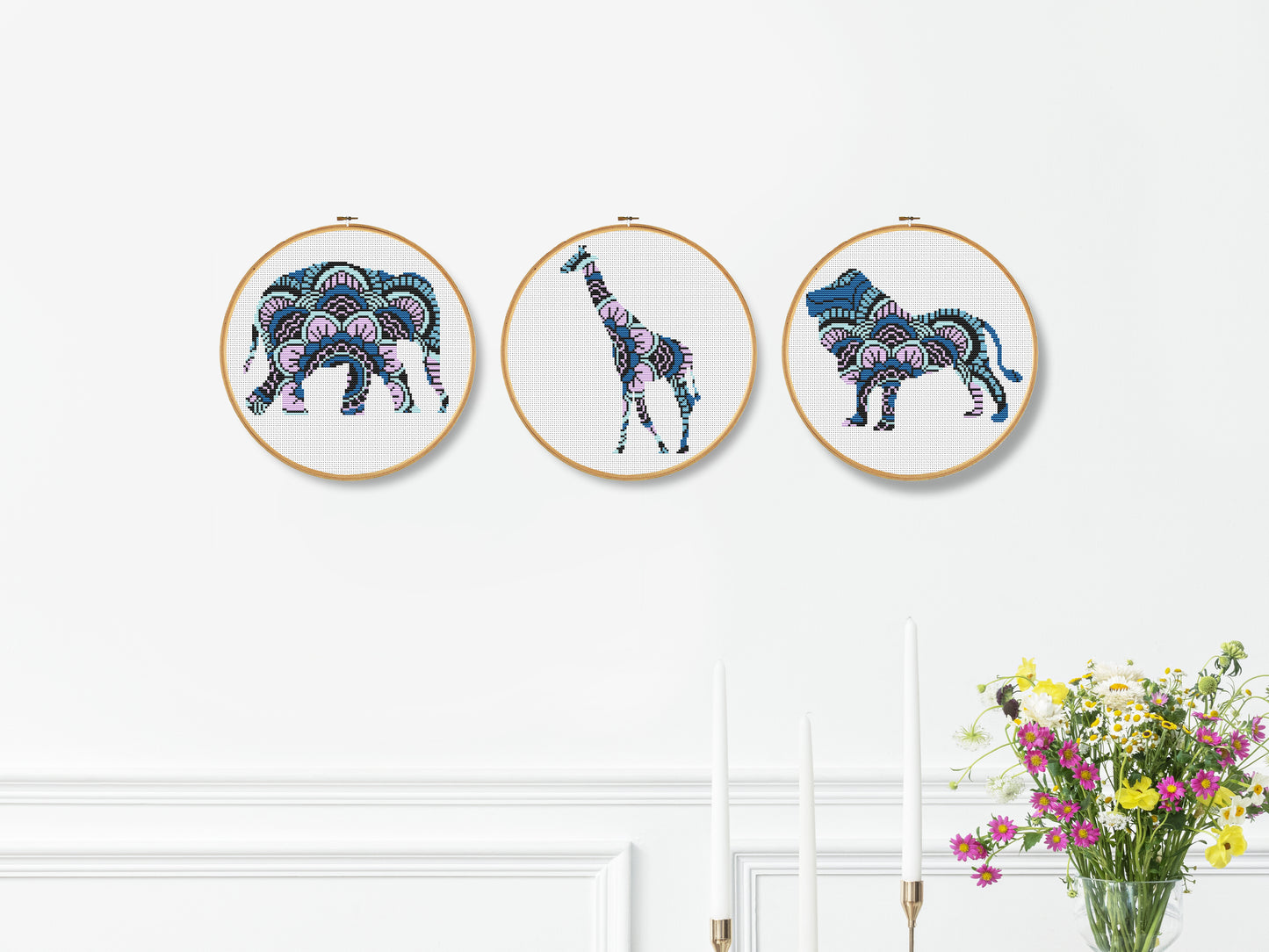 Set of three mandala animal cross stitch patterns featuring elephant, giraffe, and lion designs
