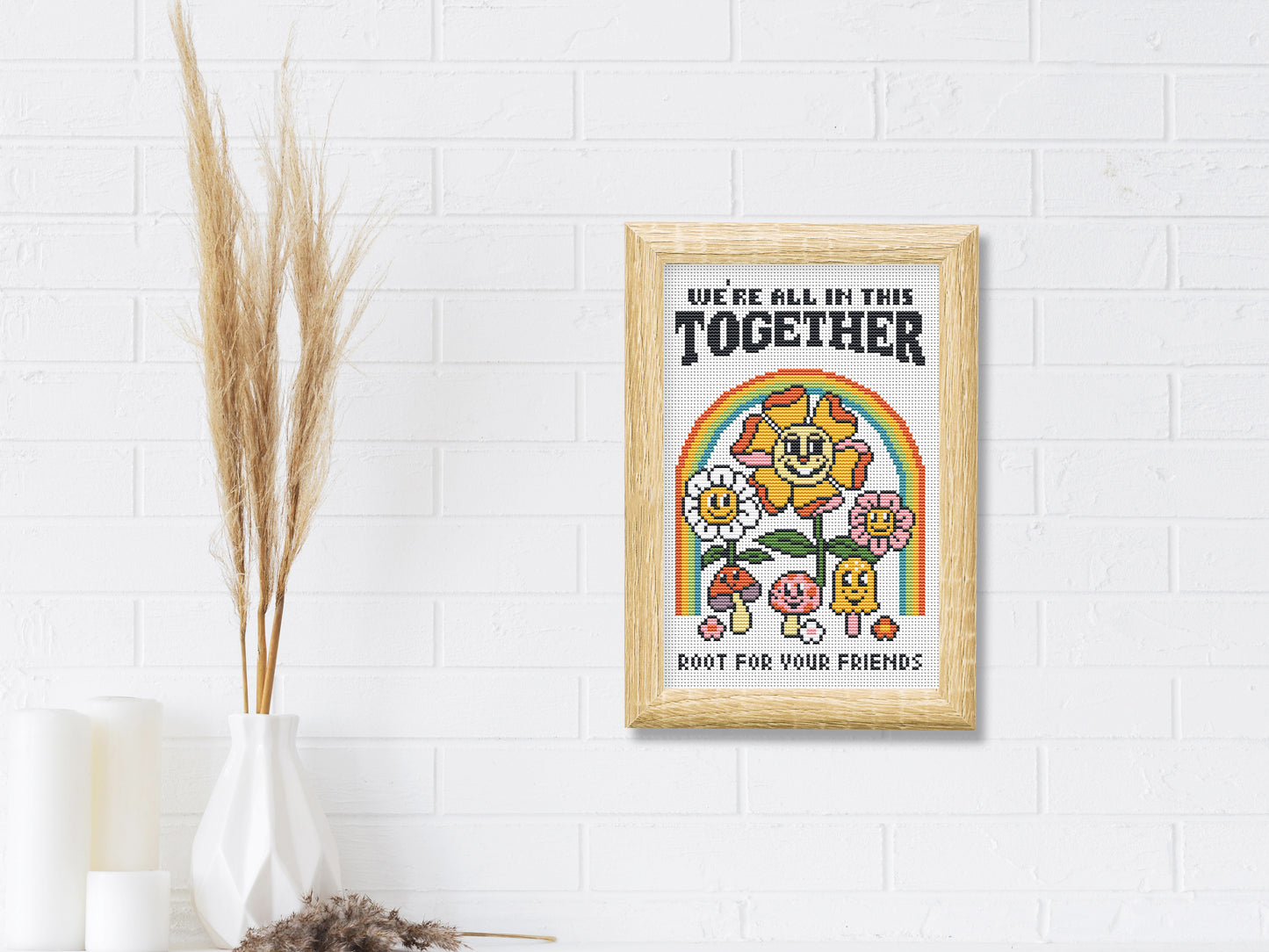 Cartoon-style cross stitch pattern with phrase "We All In This Together", modern colorful trendy design
