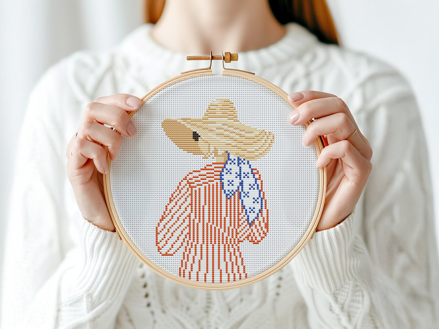 Cross stitch pattern of a woman in a hat looking at the ocean, minimalist summer beach PDF design