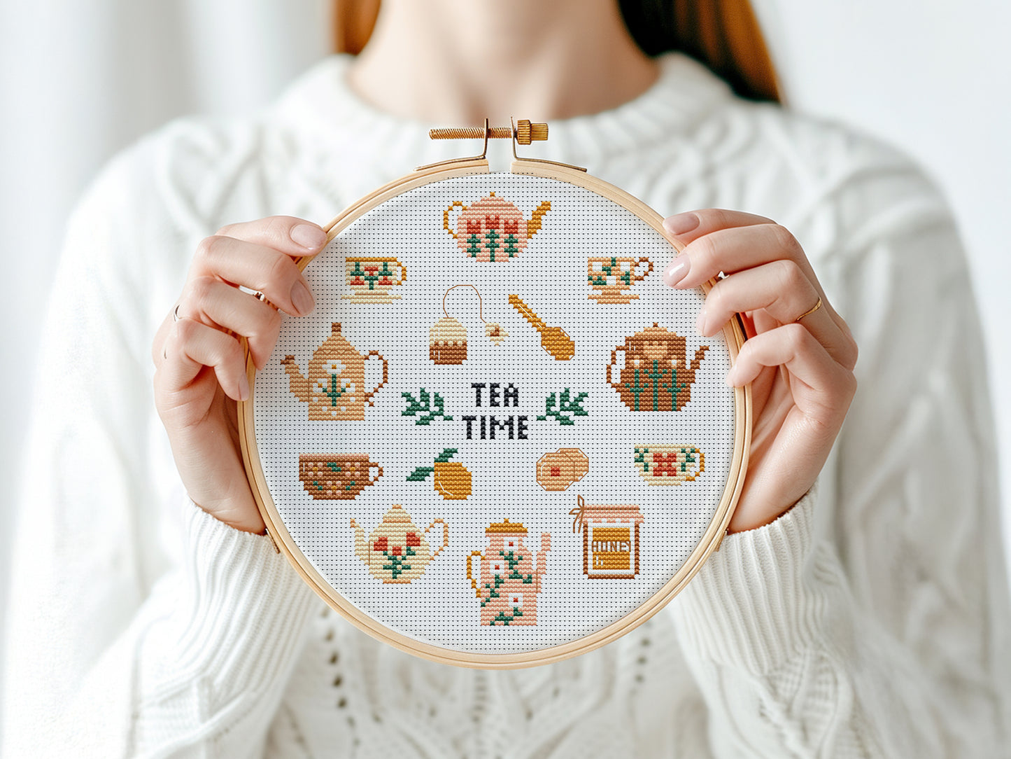 Tea Time cross stitch pattern with teapots, cups, spoons, and sweets in a cozy modern style