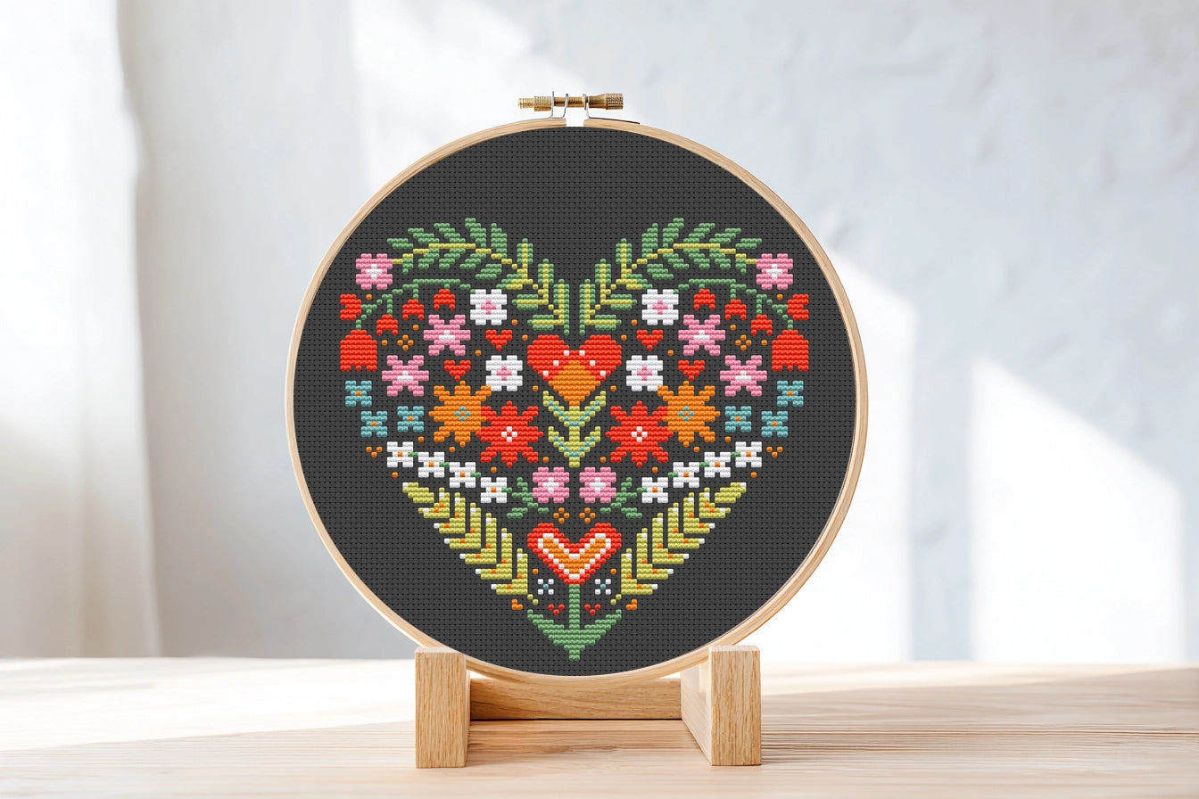 Folk Floral heart cross stitch pattern on black Aida fabric