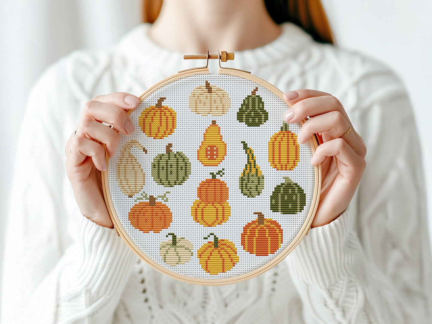 Fall cross stitch pattern with colorful pumpkins in different shapes and autumn shade