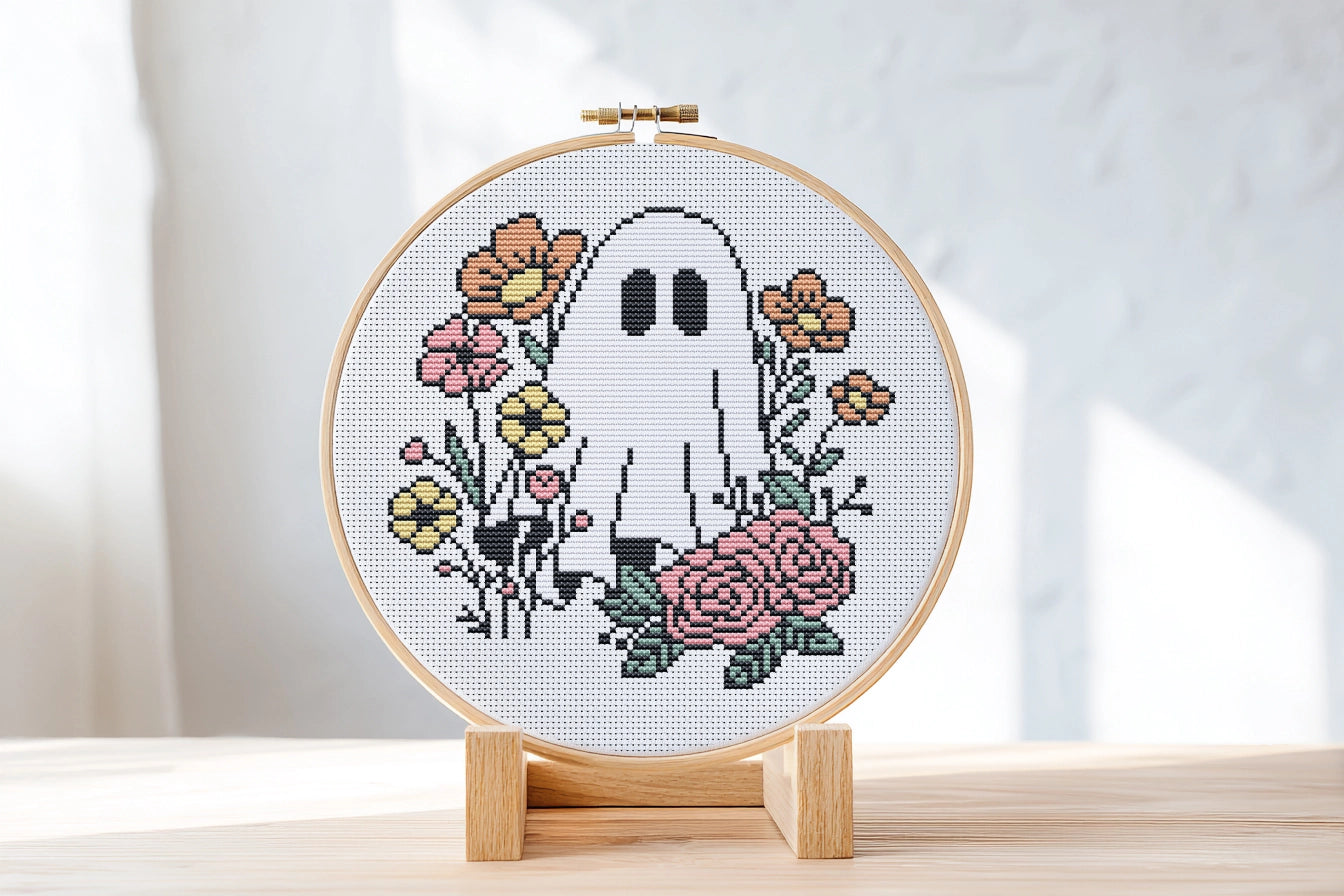 Halloween cross stitch pattern with ghost Jack and flowers