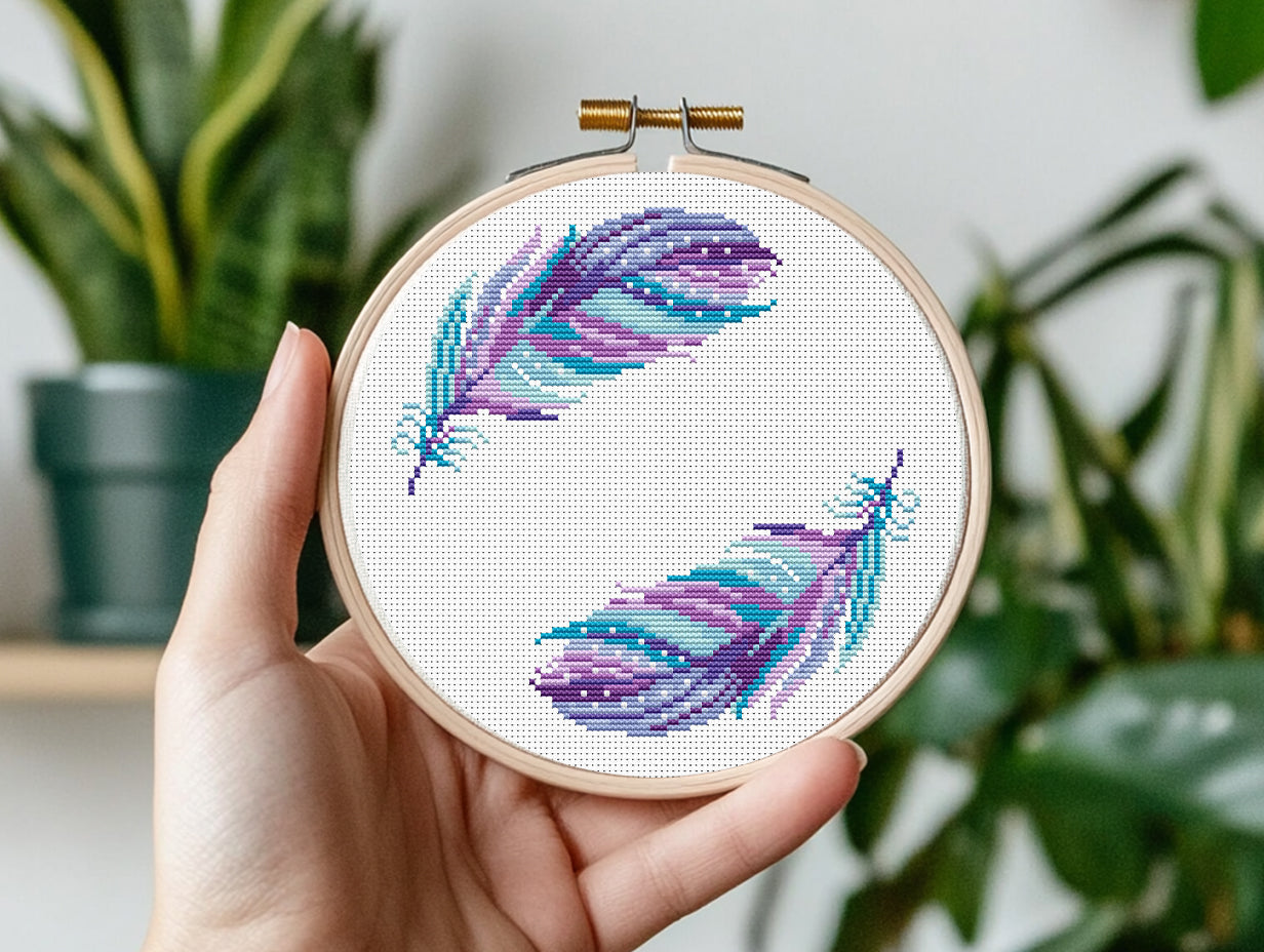 Boho cross stitch pattern with colorful feathers in free-spirited bohemian style