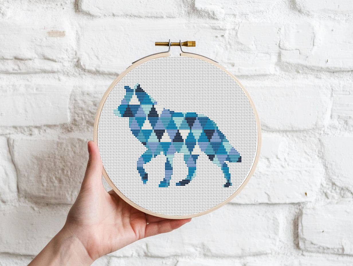 Geometric wolf cross stitch pattern in triangle shapes, modern wildlife PDF embroidery design