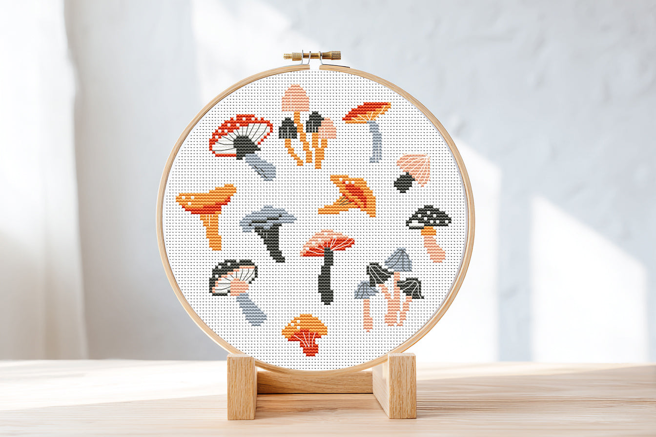 Autumn cross stitch pattern with cozy mushrooms, fall leaves, and seasonal forest elements