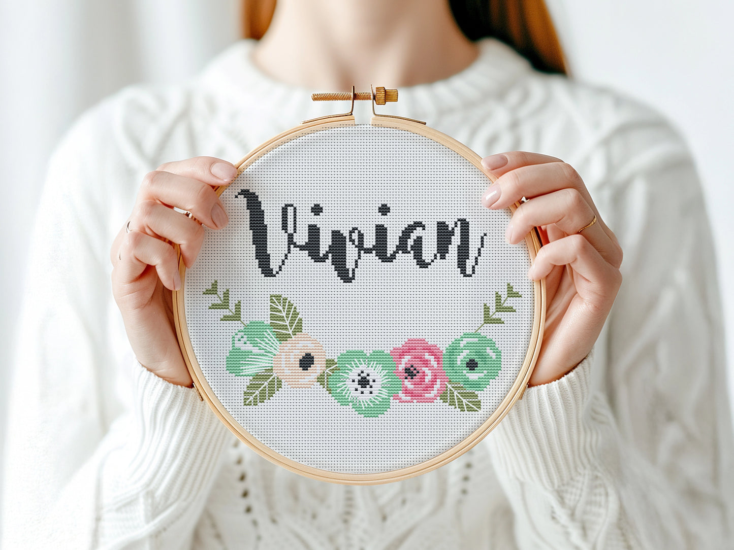 Custom name cross stitch pattern with floral branch below and personalized name on top, minimal floral embroidery design