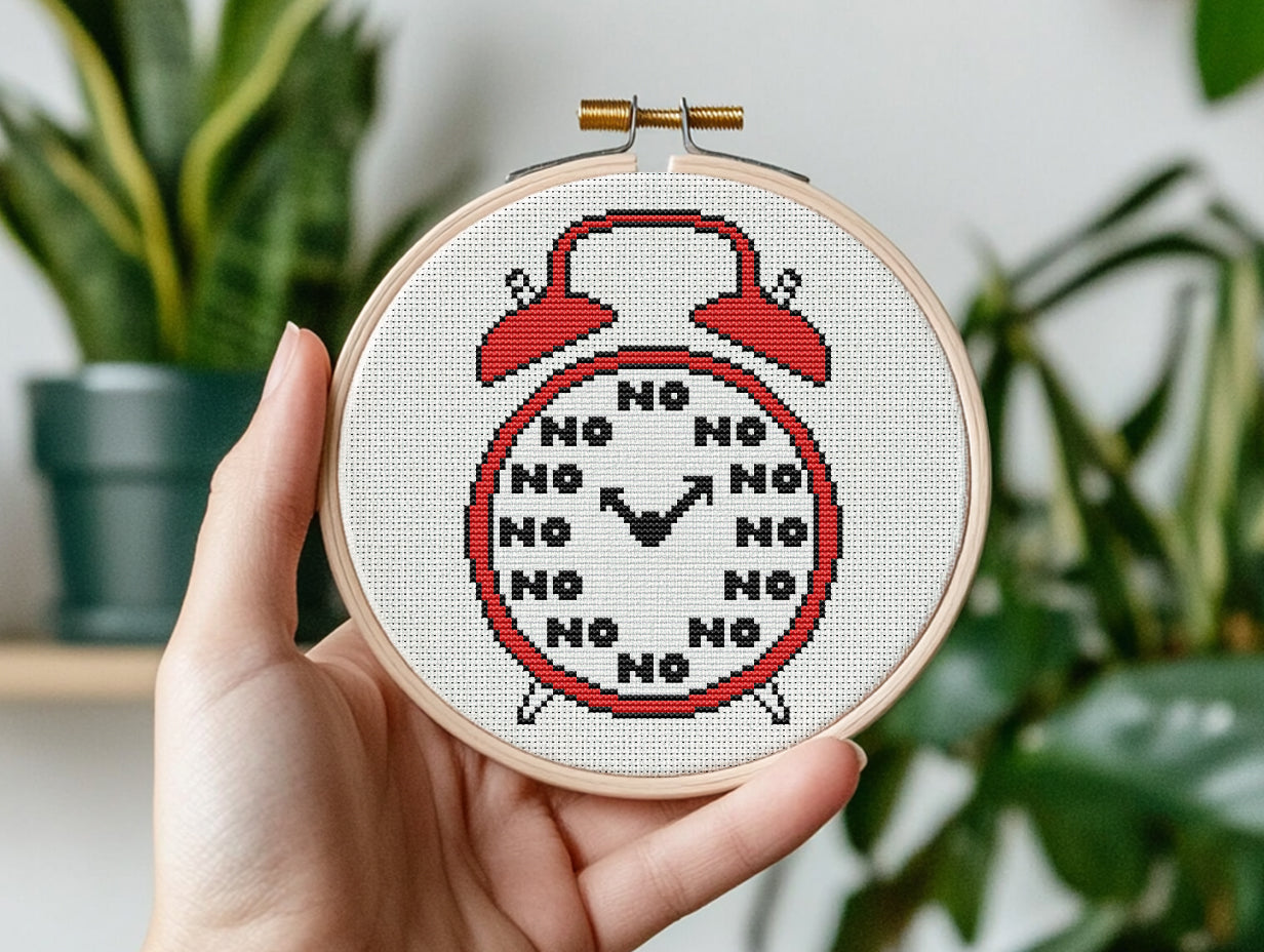 Funny alarm clock cross stitch pattern with playful design