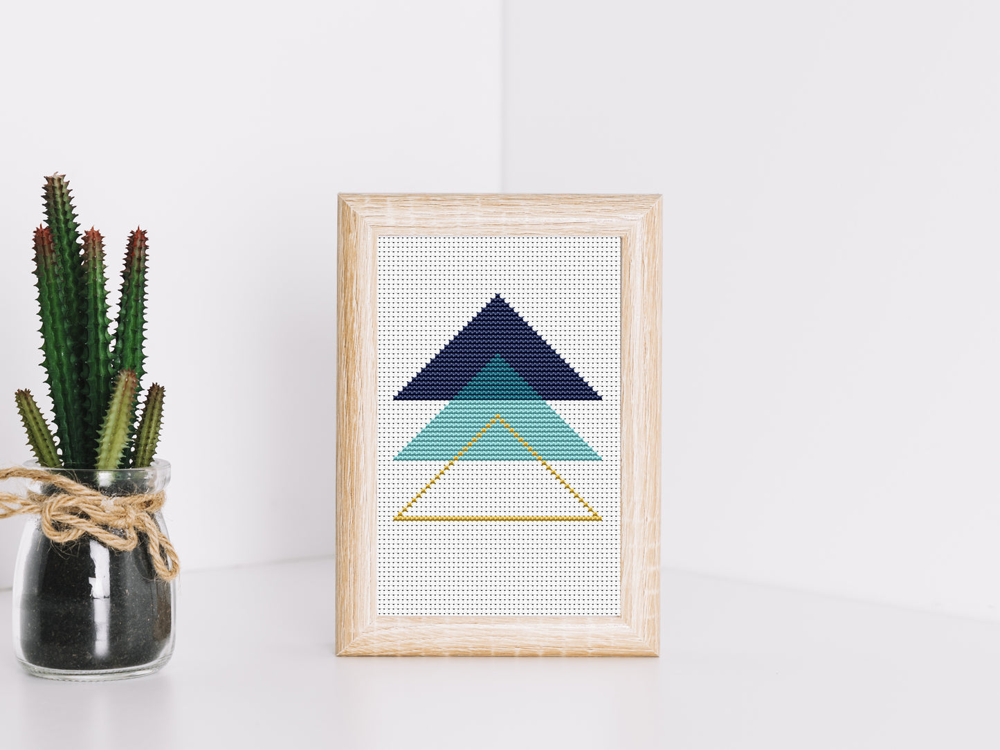 Triangle blue abstract cross stitch pattern with modern geometric design