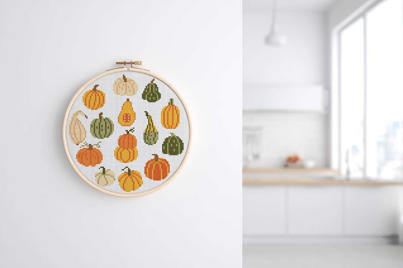 Fall cross stitch pattern with colorful pumpkins in different shapes and autumn shade