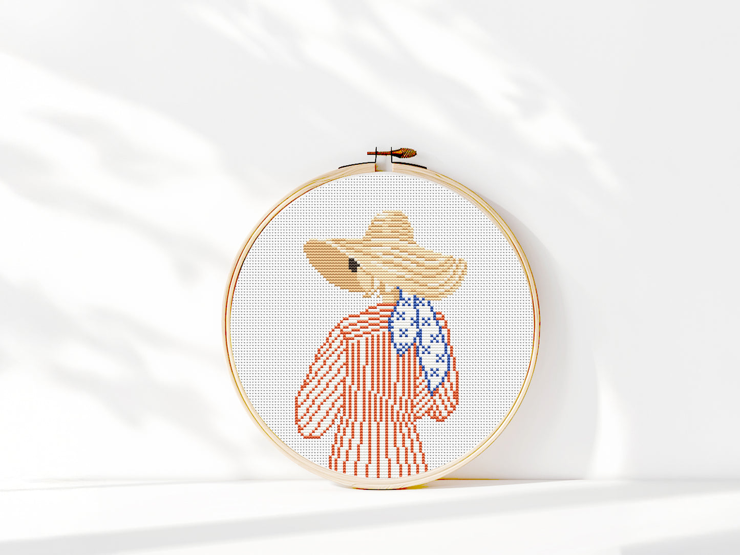 Cross stitch pattern of a woman in a hat looking at the ocean, minimalist summer beach PDF design
