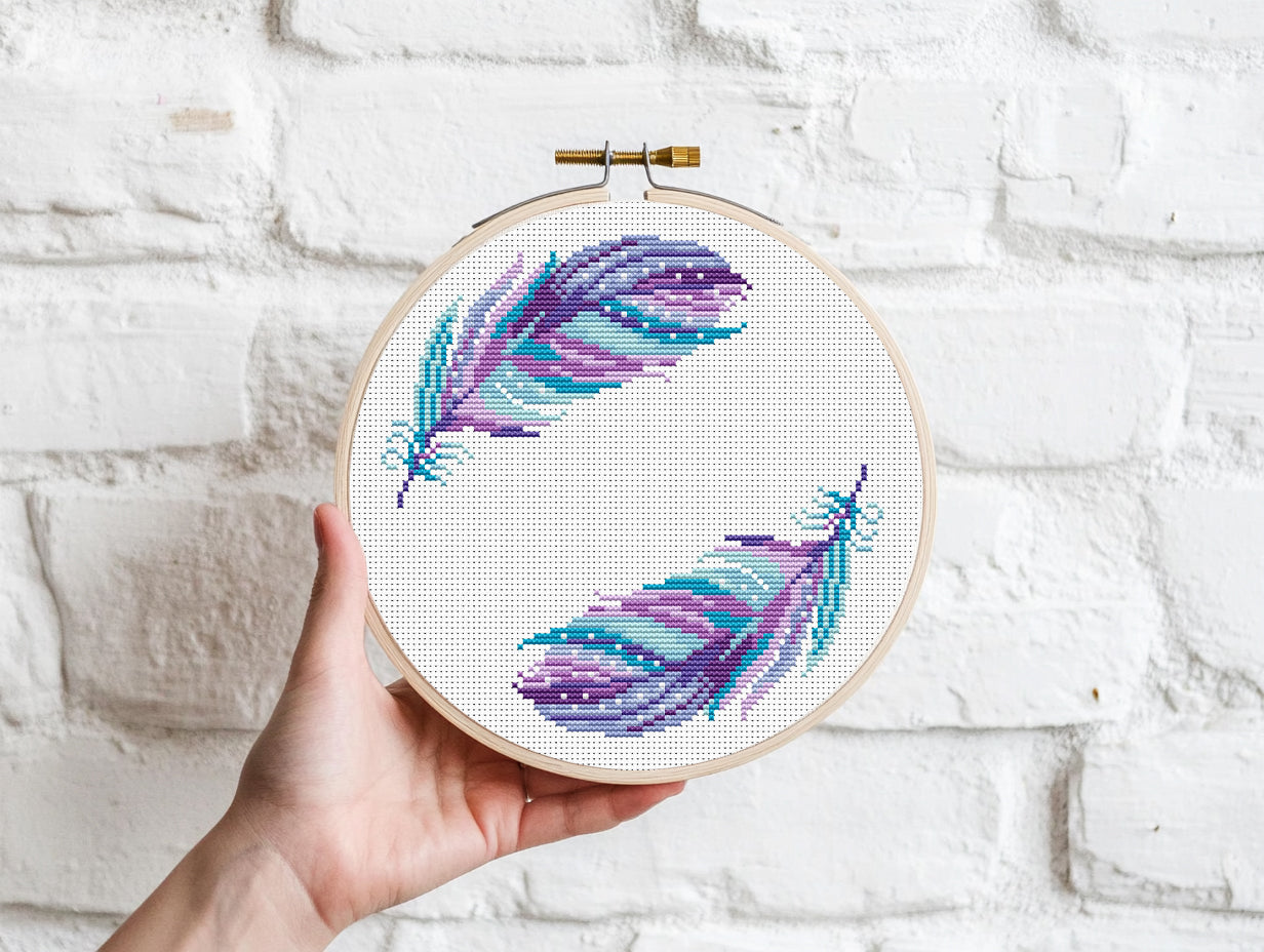 Boho cross stitch pattern with colorful feathers in free-spirited bohemian style