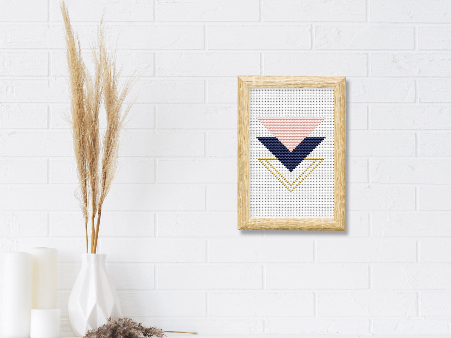Triangle rose and gold cross stitch pattern with geometric and floral design