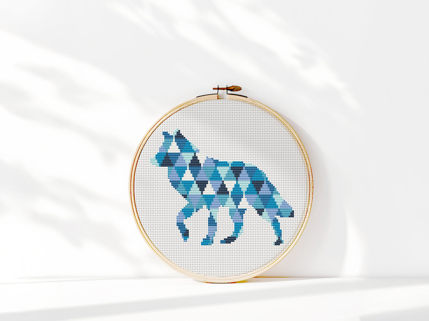 Geometric wolf cross stitch pattern in triangle shapes, modern wildlife PDF embroidery design