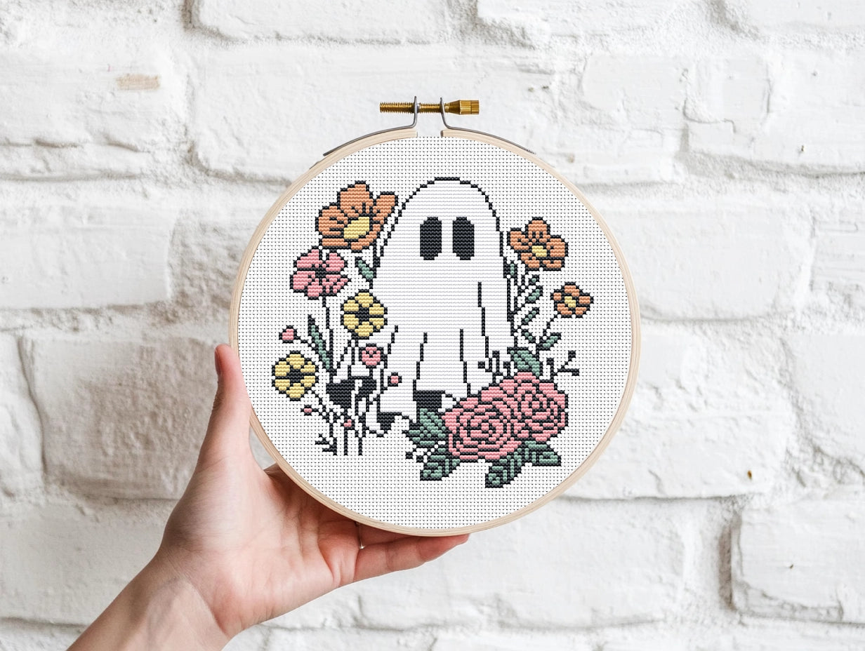 Halloween cross stitch pattern with ghost Jack and flowers