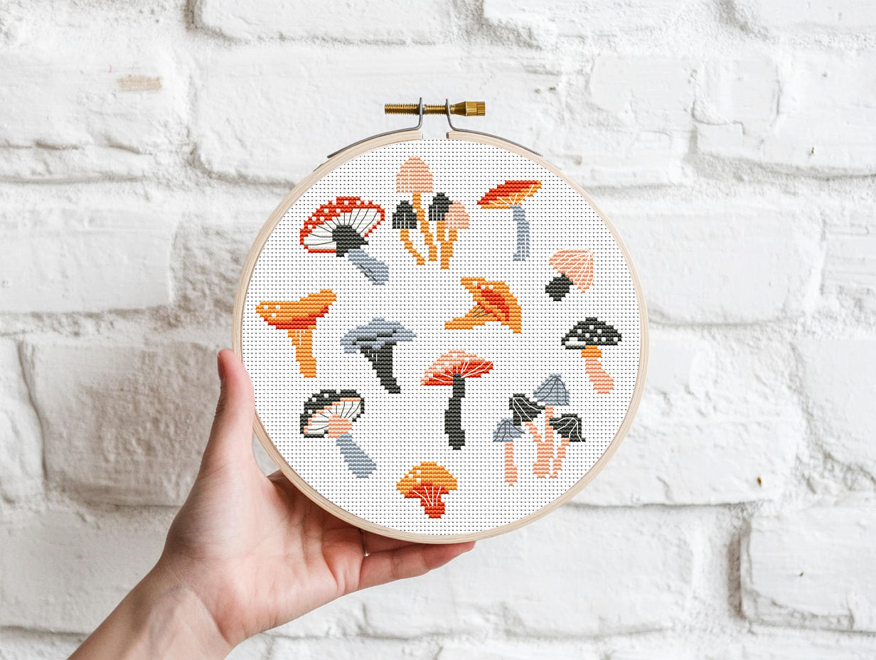 Autumn cross stitch pattern with cozy mushrooms, fall leaves, and seasonal forest elements