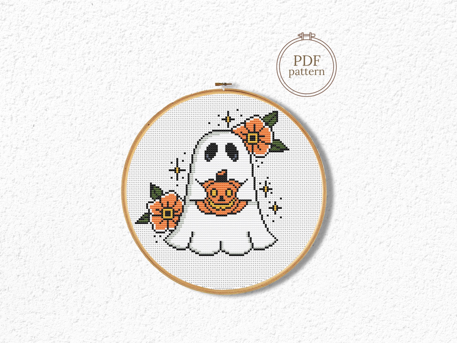 Halloween cross stitch pattern with a spooky ghost design