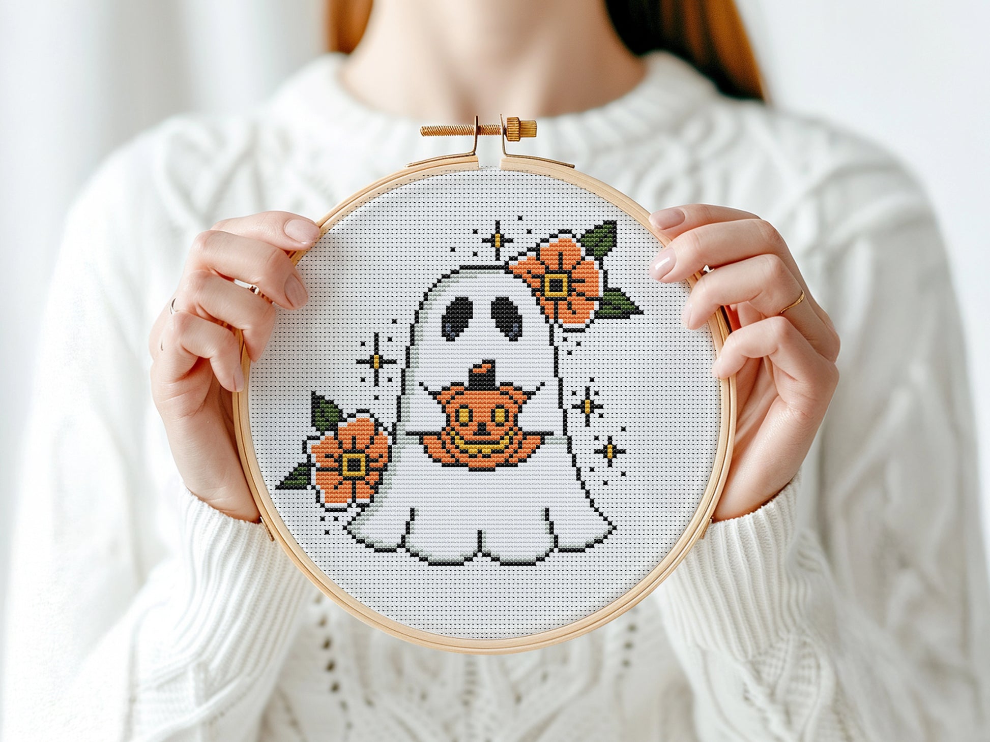 Halloween cross stitch pattern with a spooky ghost design