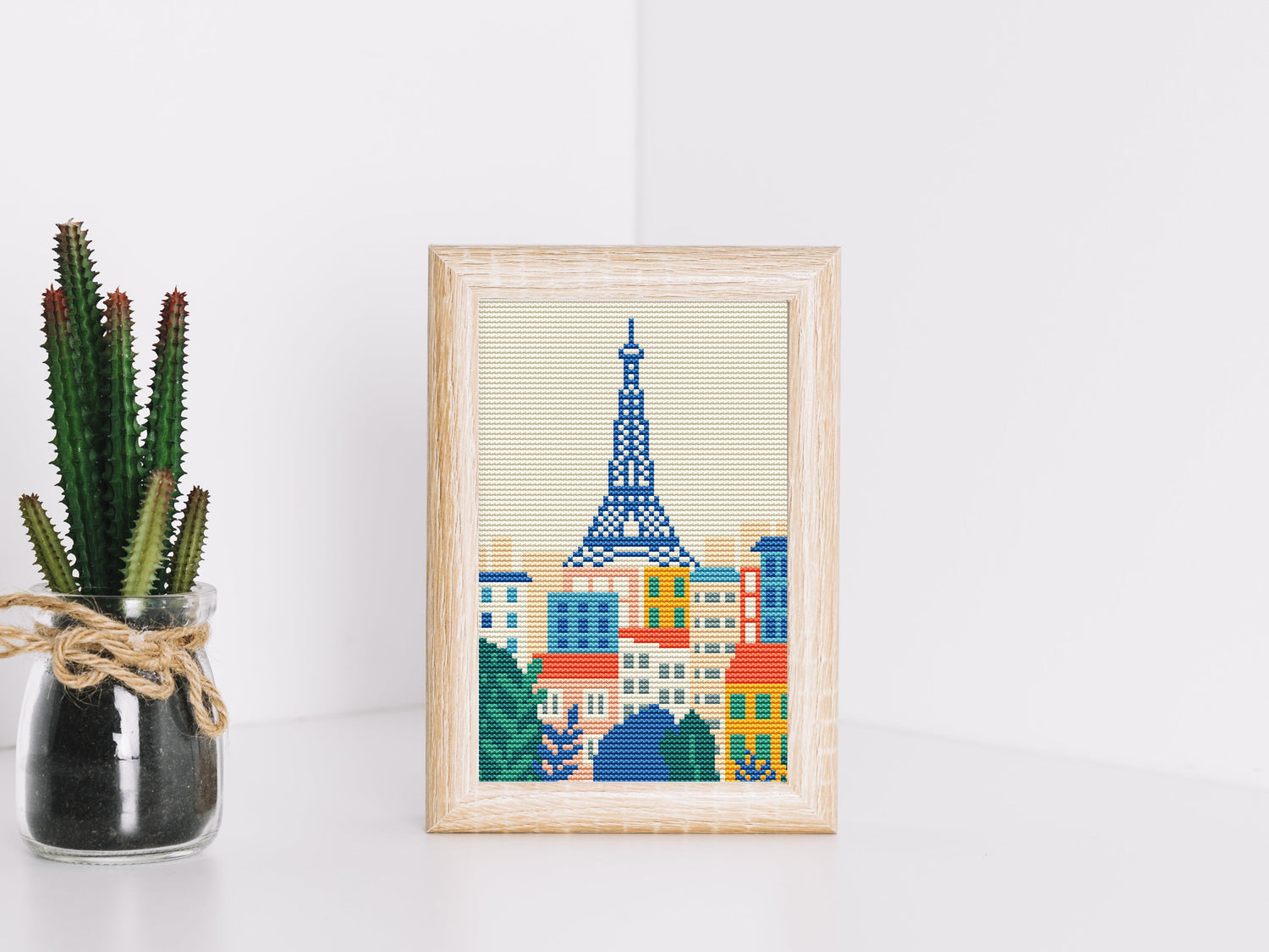 Cross stitch pattern inspired by travel, featuring cities and countries in PDF format for embroidery