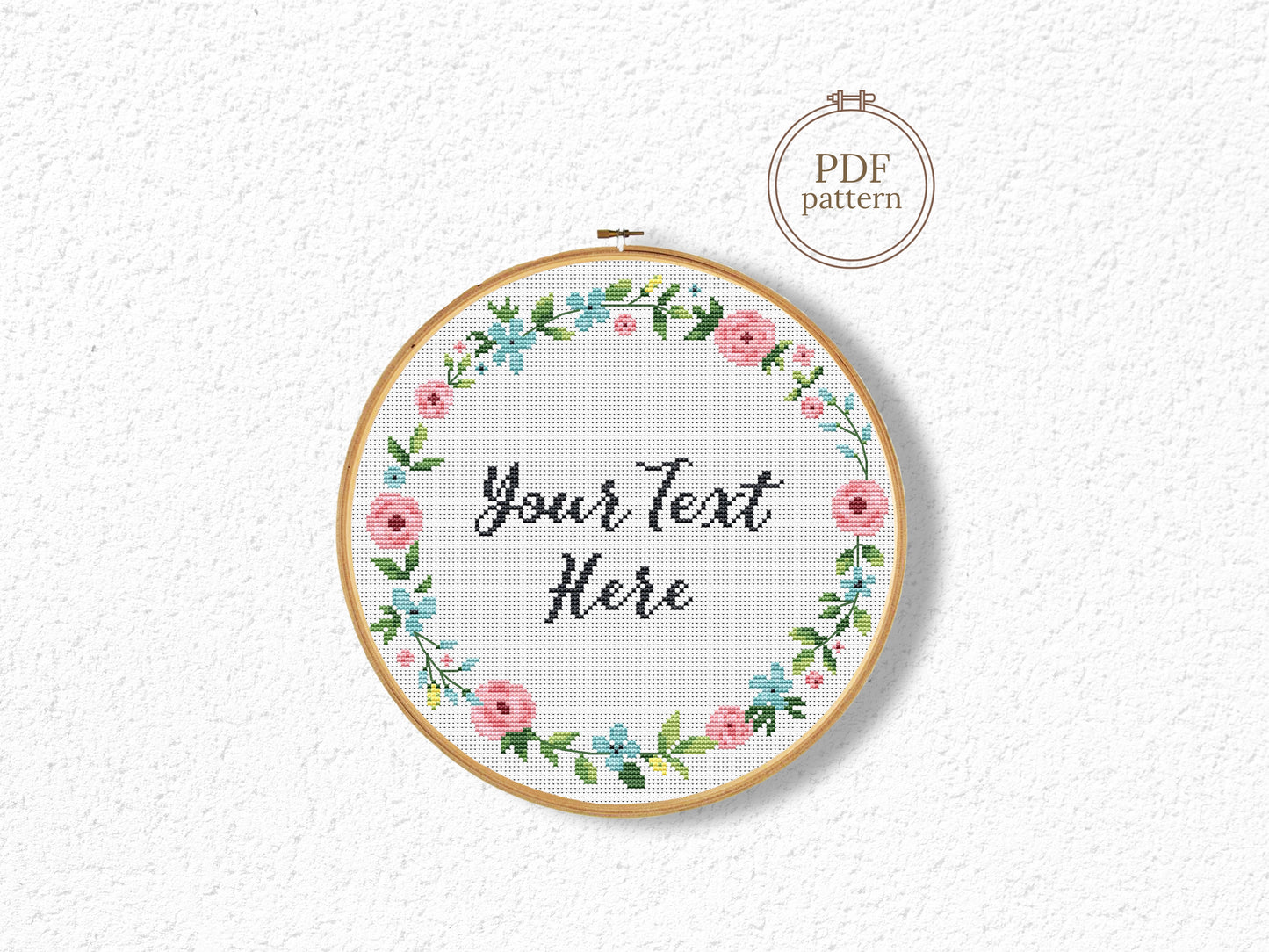 Custom cross stitch pattern with floral wreath and personalized text placeholder - customizable PDF design