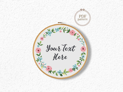 Custom cross stitch pattern with floral wreath and personalized text placeholder - customizable PDF design