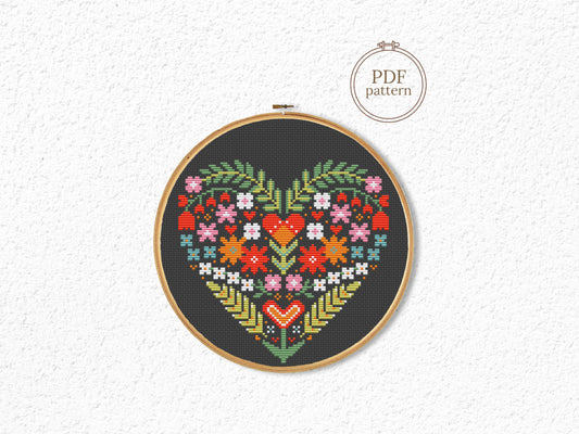 Folk Floral heart cross stitch pattern on black Aida fabric