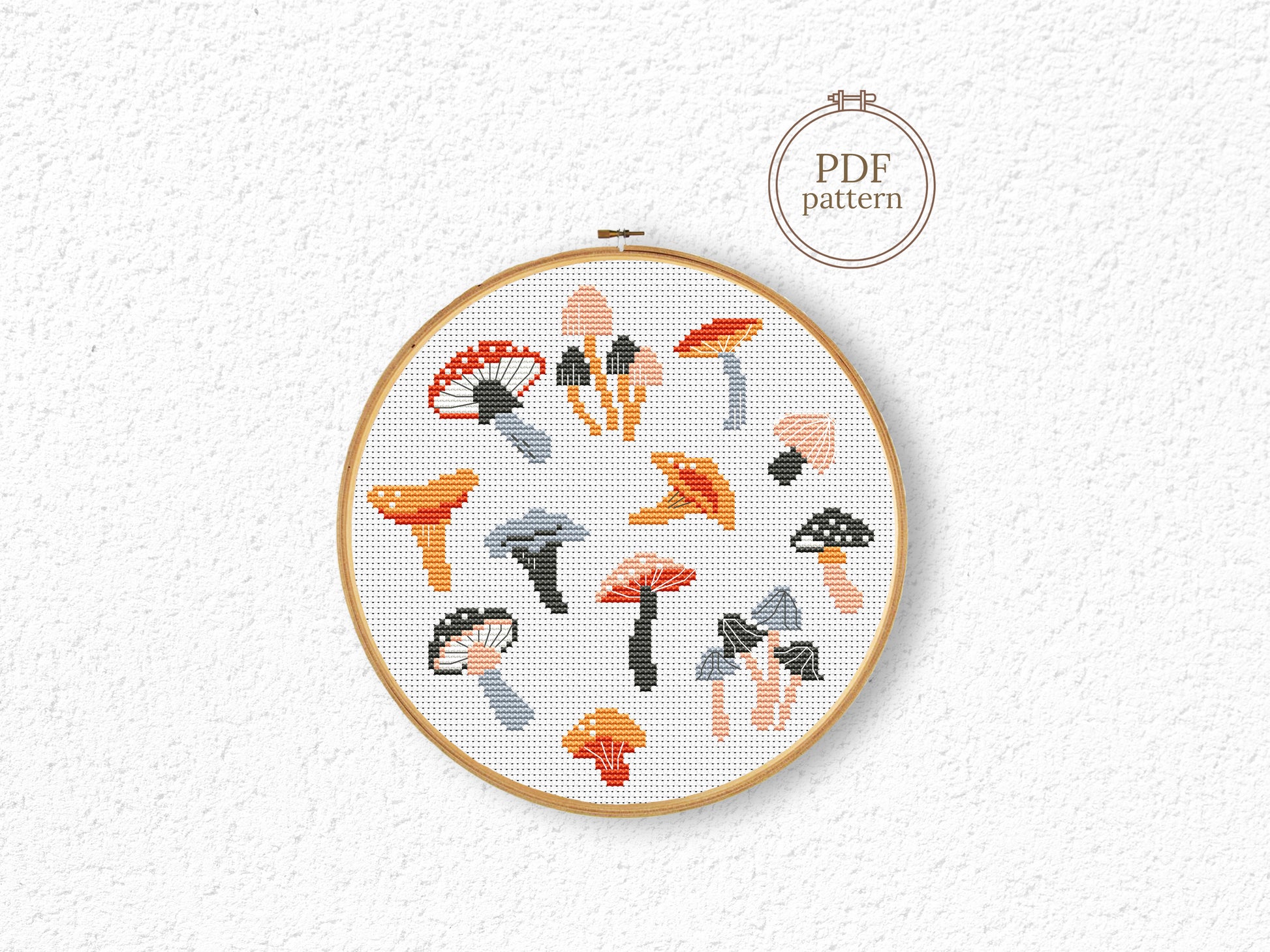 Autumn cross stitch pattern with cozy mushrooms, fall leaves, and seasonal forest elements