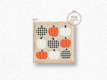 Cross-stitch pattern with pumpkins on a textured white background