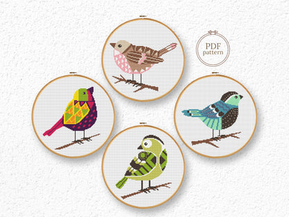 Set of four bird cross stitch patterns with detailed feathers and colorful designs