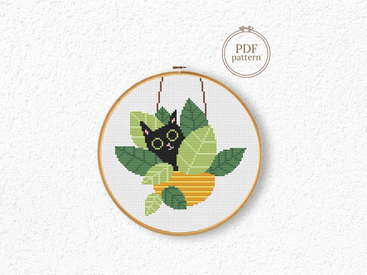 Funny cross stitch pattern with cat sitting in plant pots, playful home decor design