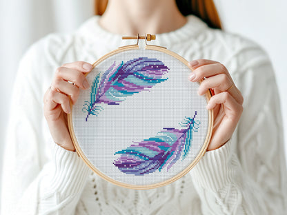 Boho cross stitch pattern with colorful feathers in free-spirited bohemian style