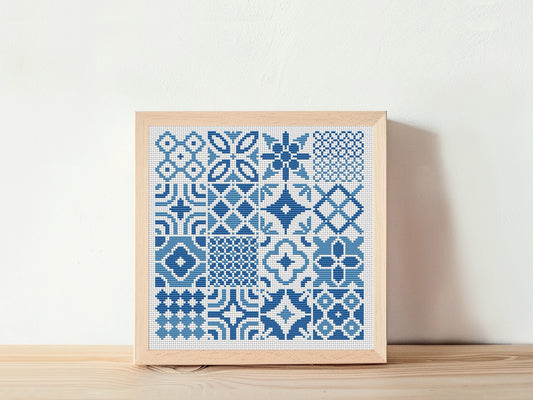 Blue tile style cross stitch pattern with intricate ceramic-inspired design