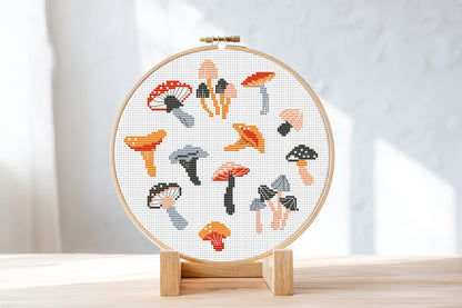 Autumn cross stitch pattern with cozy mushrooms, fall leaves, and seasonal forest elements
