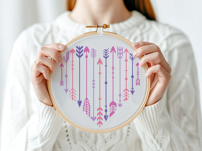Free arrows in heart shape cross stitch pattern – minimalist modern embroidery PDF design for Valentine’s or love-themed projects