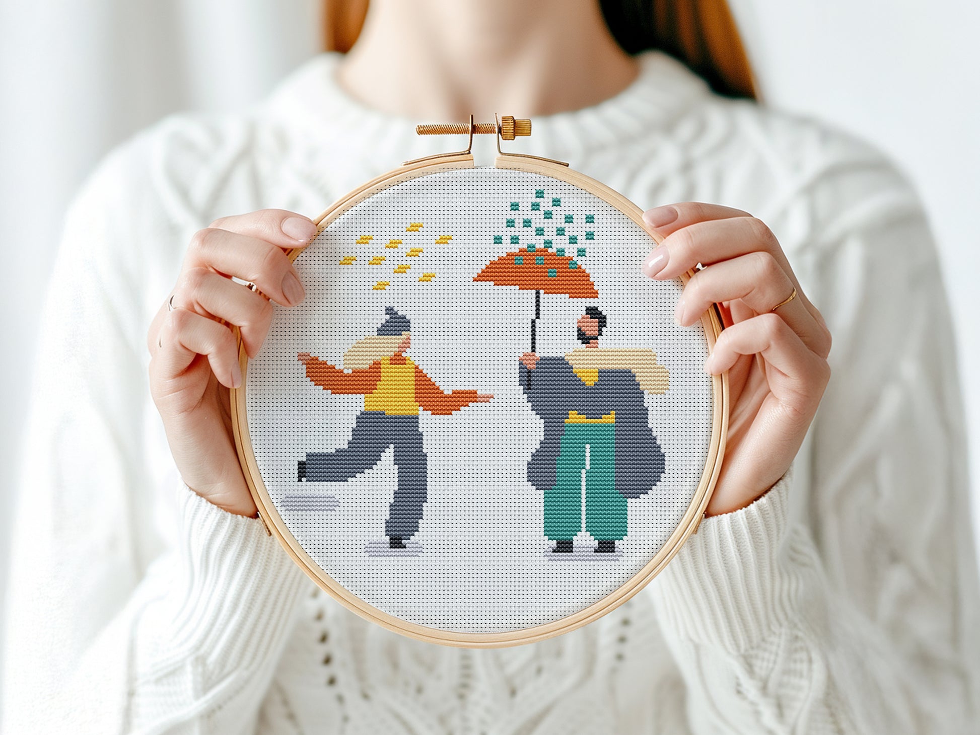 Set of three autumn cross stitch patterns with people, umbrellas, rain, and puddle