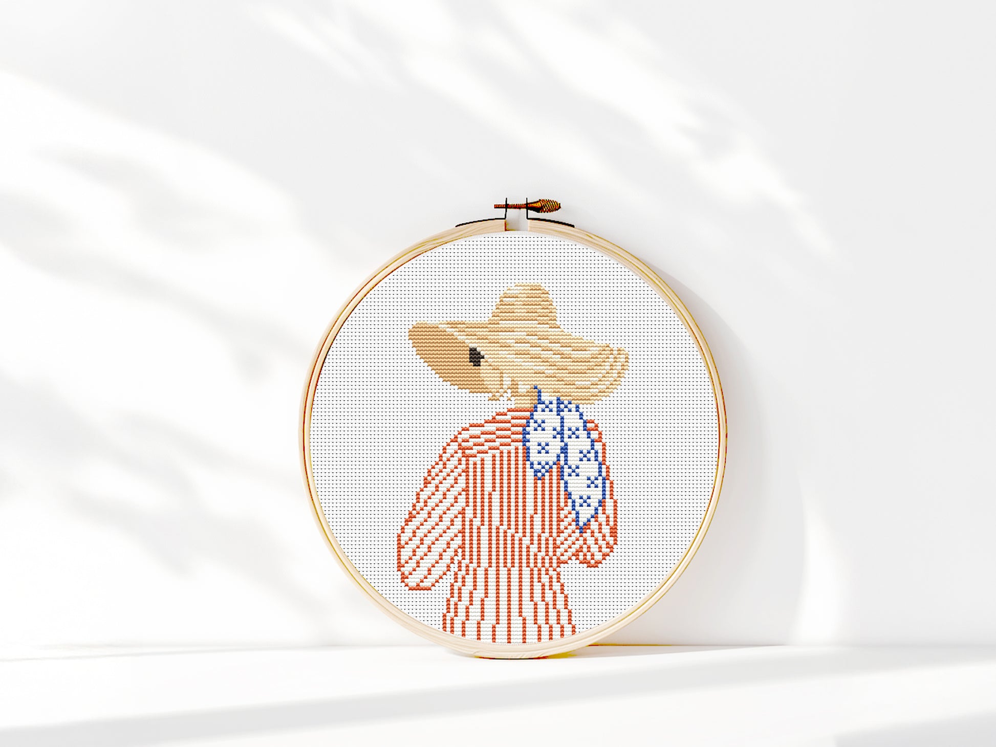 Cross stitch pattern of a woman in a hat looking at the ocean, minimalist summer beach PDF design