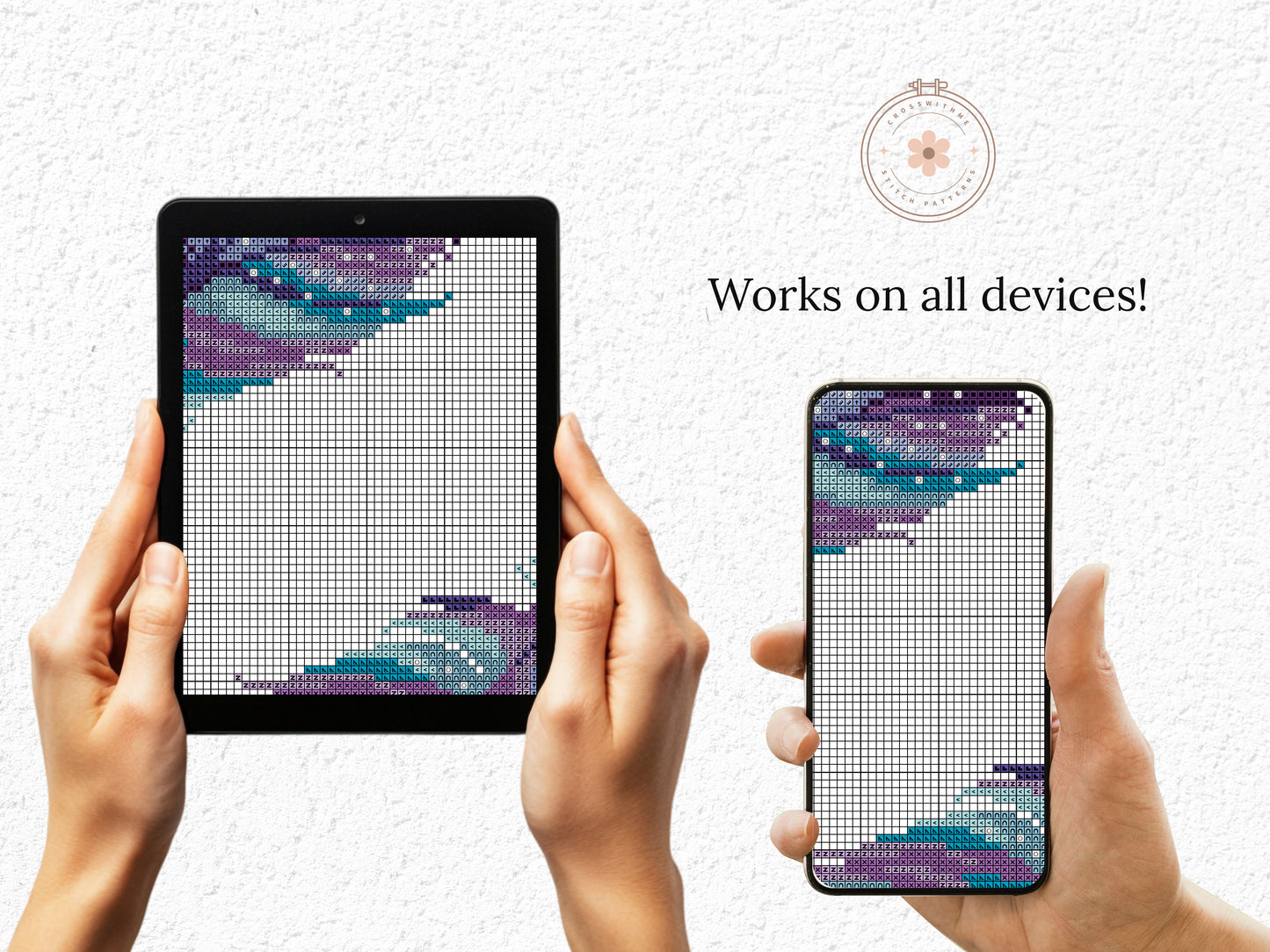 Two devices displaying a cross-stitch pattern with hands holding them against a light gray background.