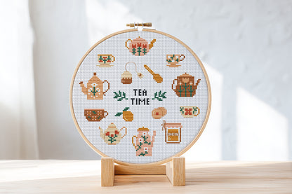 Tea Time cross stitch pattern with teapots, cups, spoons, and sweets in a cozy modern style