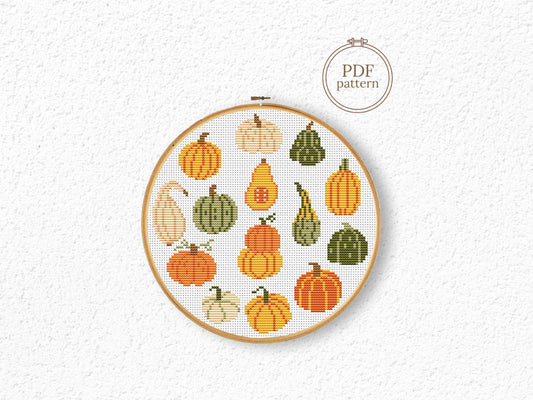 Fall cross stitch pattern with colorful pumpkins in different shapes and autumn shade